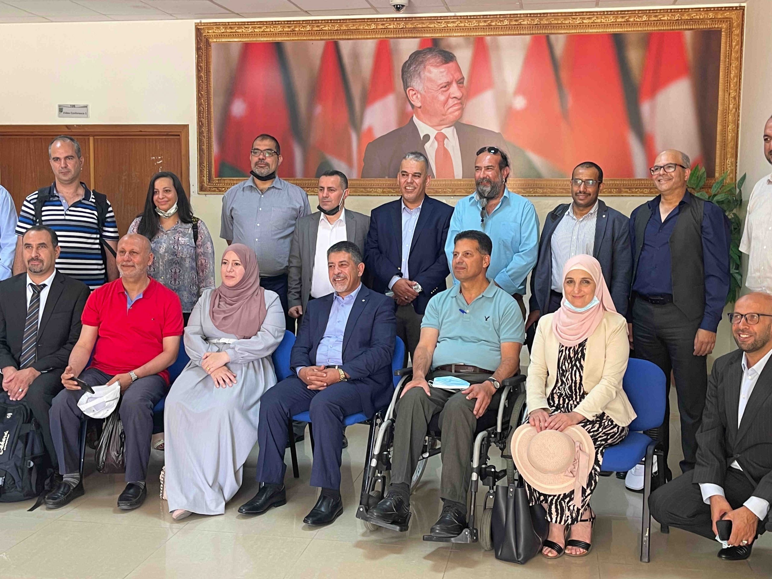 Management Meeting at University of Jordan Aqaba Group with staff Smiling